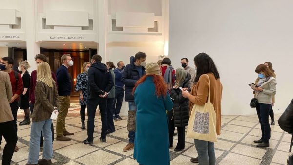 Attendees of the 3rd Arctic Shorts film evening wait for the films to start outside Salle M at BOZAR - Photo by Joseph Cheek, International Polar Foundation