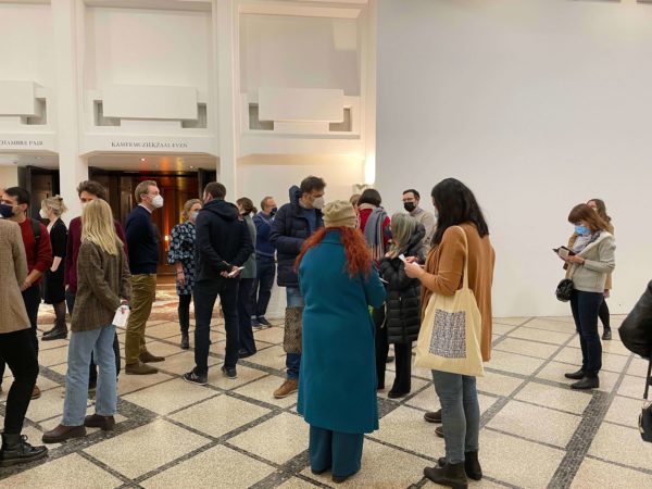 Attendees of the 3rd Arctic Shorts film evening wait for the films to start outside Salle M at BOZAR - Picture by Joseph Cheek, International Polar Foundation